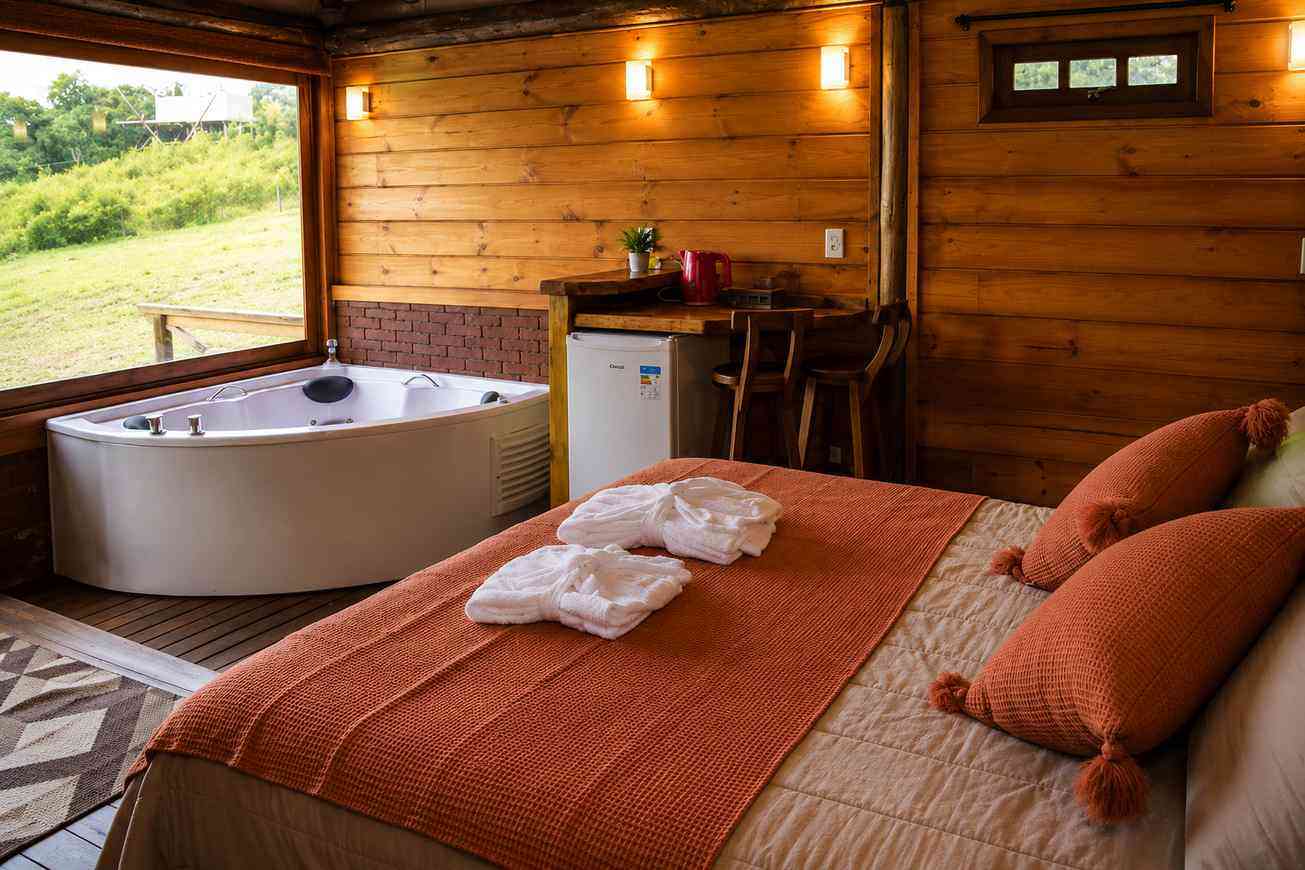 Queen room with spa bath, timber interiors and warm ambient lighting